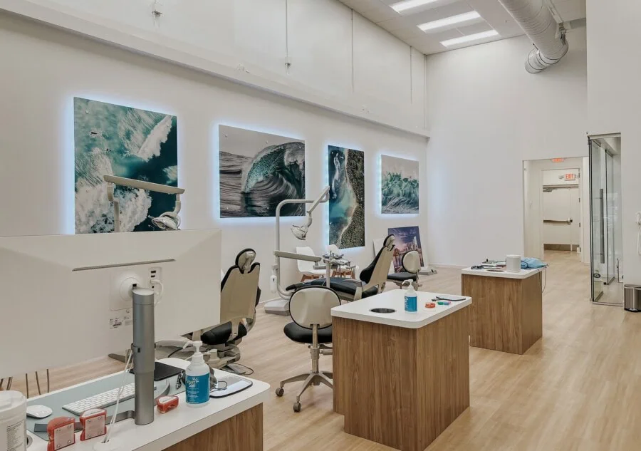 Bold Bite Orthodontics treatment area with large back-lit photos of water and waves